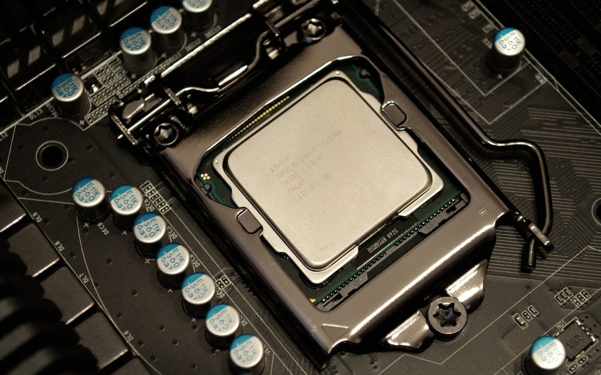 Close-up photograph of a processor seated in a desktop motherboard socket.